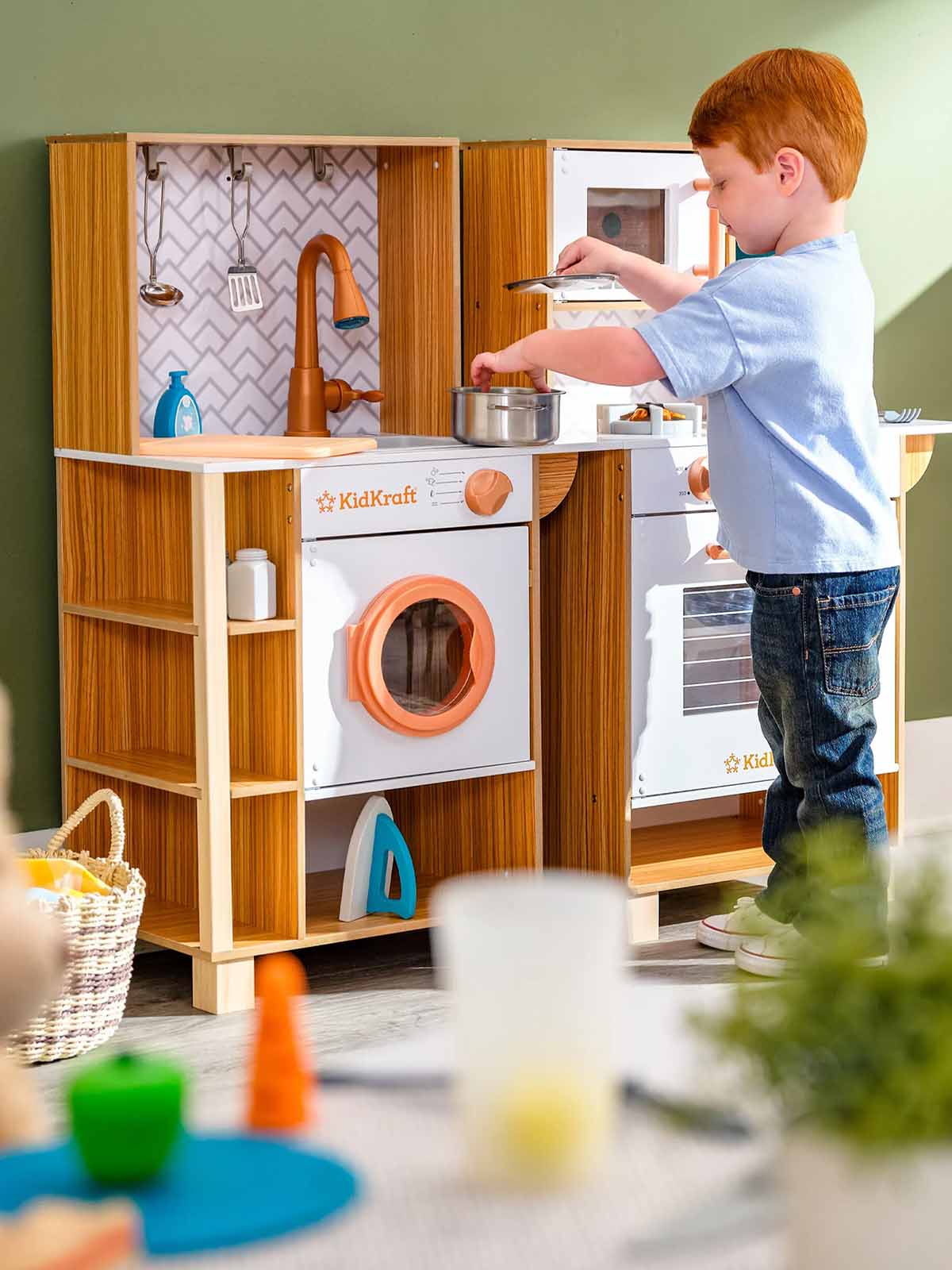 Child playing with KidKraft kitchen set