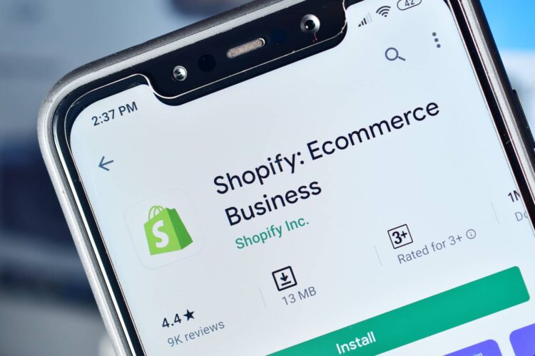 A smartphone screen displays the Shopify: Ecommerce Business app page in the Google Play Store, showing the app icon, name, rating, size, and install button.