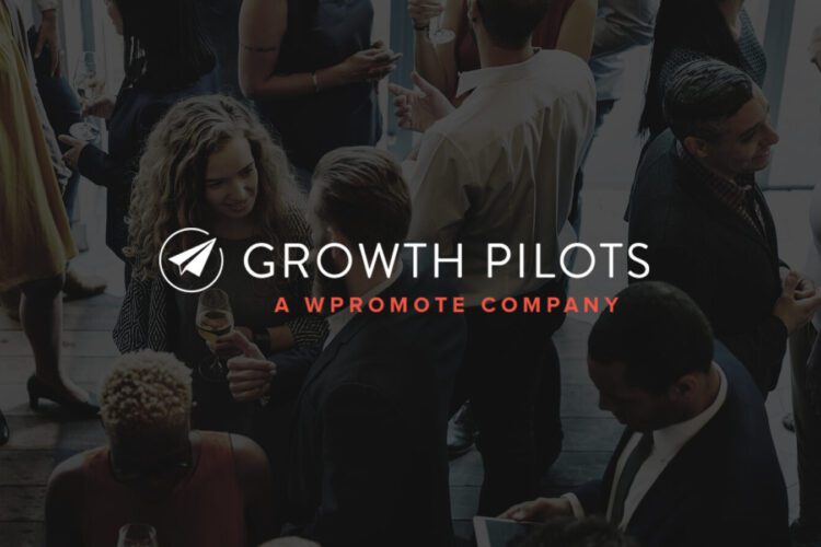 A group of people in business attire socializing at an indoor event, with the text "Growth Pilots: A Wpromote Company" overlaid in the center.