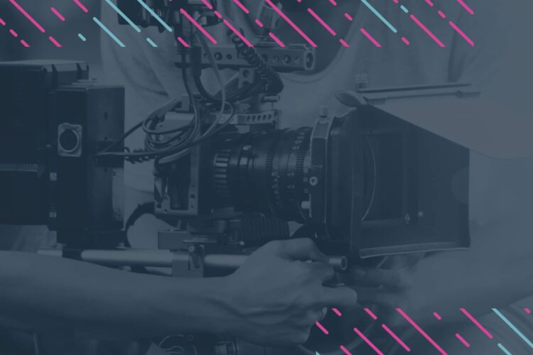 A person adjusts a professional video camera rig; the image has a blue tint with diagonal pink and blue graphic lines overlaying the top.