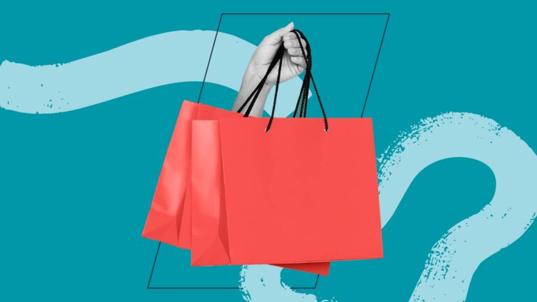 A hand holds two red shopping bags by their black handles against a teal background with abstract shapes.