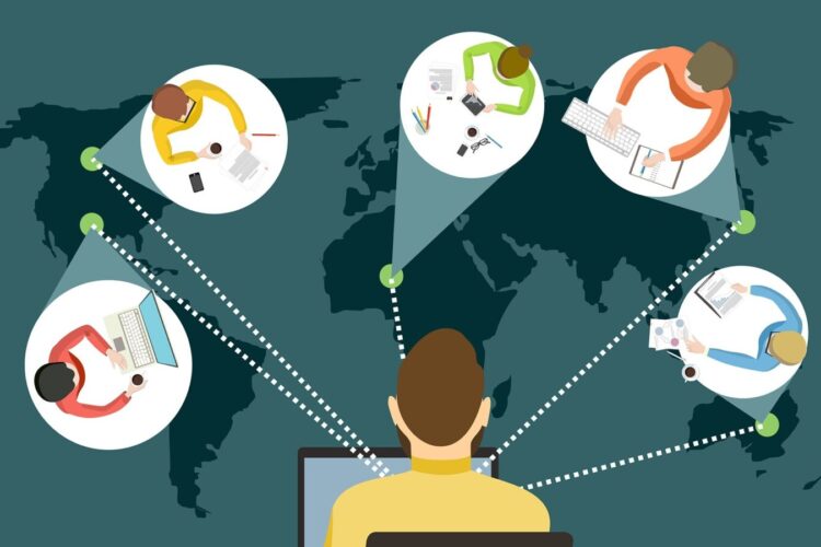 Illustration of five people working on computers in different locations, connected by dotted lines over a world map, representing remote collaboration or global teamwork.