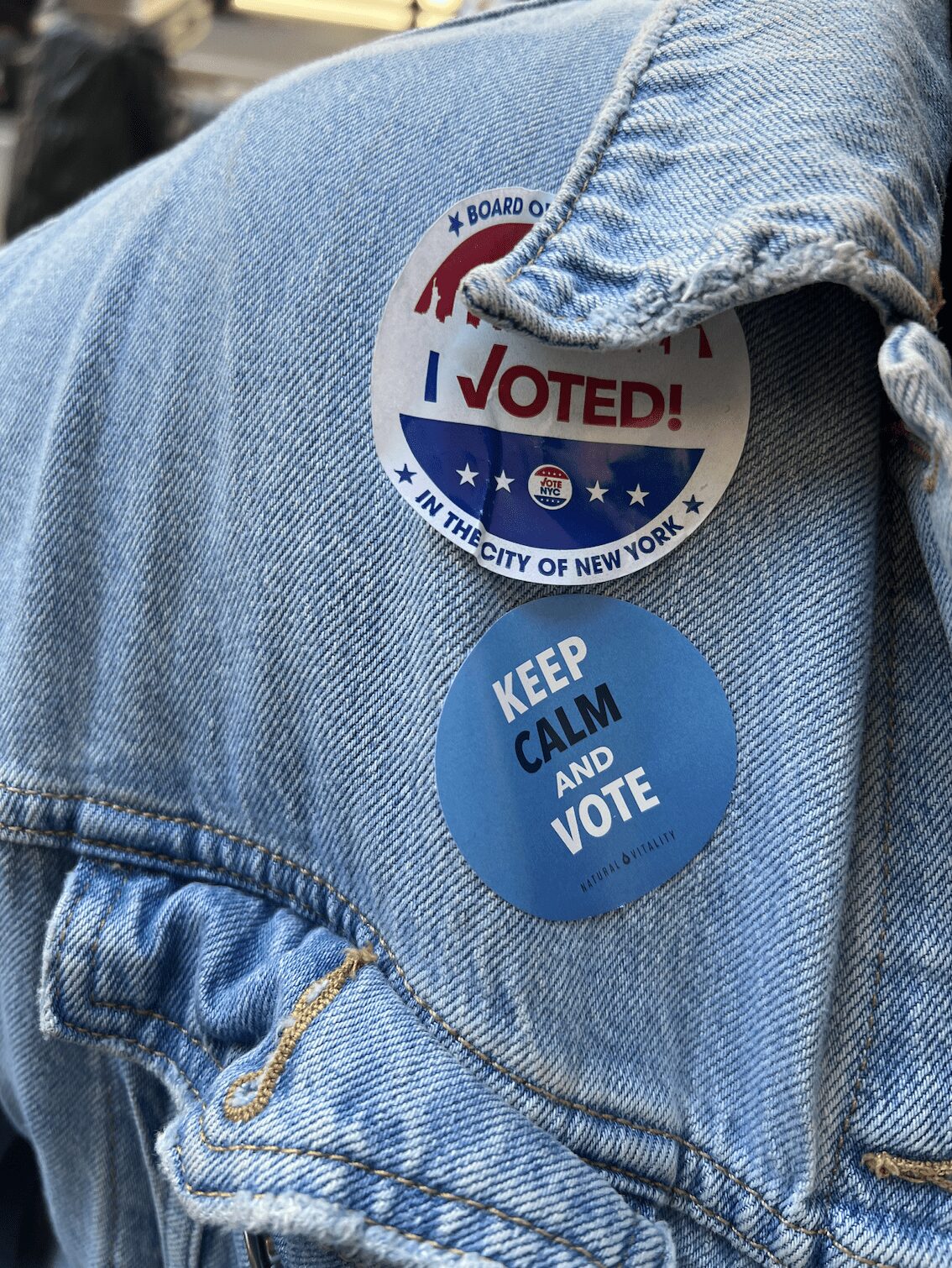 Picture of a jacket with a sticker that reads "Keep CALM and vote"