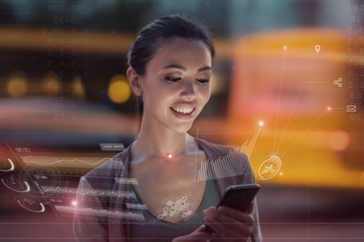 A woman looks at her smartphone and smiles, surrounded by digital data graphics and charts, with a blurred city background.