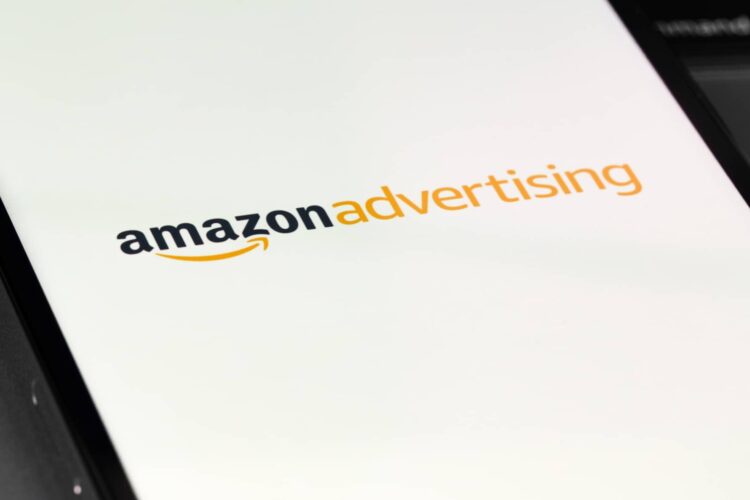 A mobile screen displays the Amazon Advertising logo on a white background.