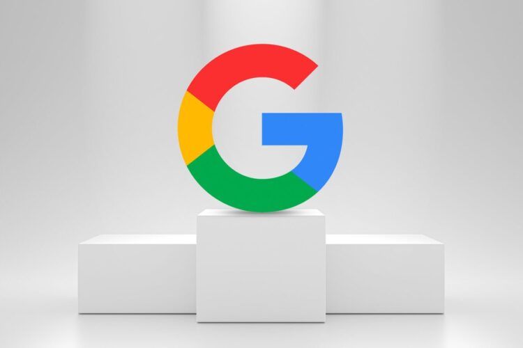 The Google logo in its signature colors is displayed on a white pedestal against a light gray background.