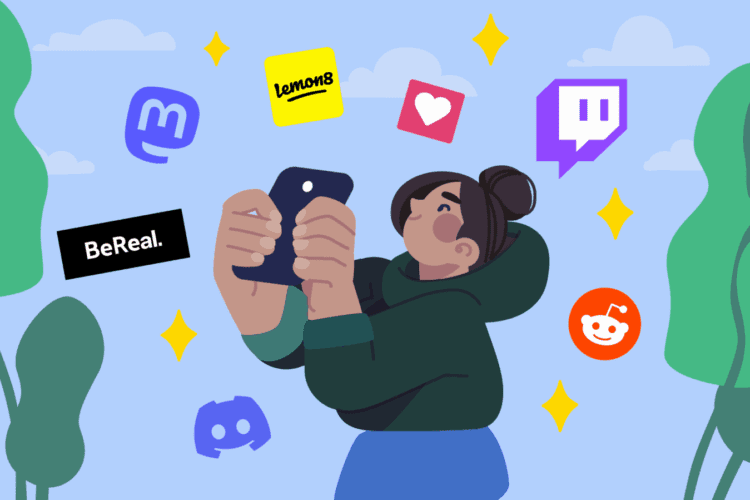 A person holds up a phone surrounded by social media app icons, including BeReal, Twitch, Reddit, Discord, Lemon8, Mastodon, and a heart symbol.