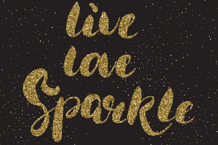 Gold glitter text on a black background reads "live love sparkle," surrounded by scattered gold dots resembling glitter or stars.