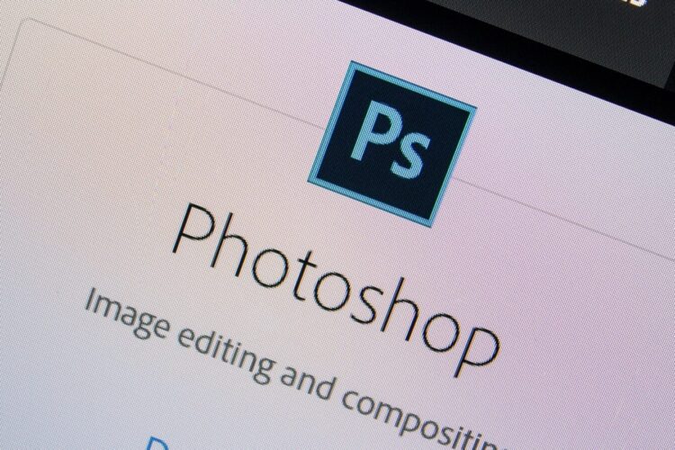 A computer screen displays the Adobe Photoshop logo and the words "Photoshop Image editing and compositing.