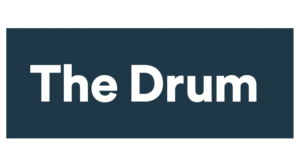 The Drum" text in bold black font centered on a dark blue rectangular background.