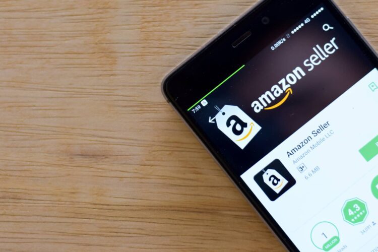 A smartphone displays the Amazon Seller app page on the Google Play Store, with the option to install visible on the screen.