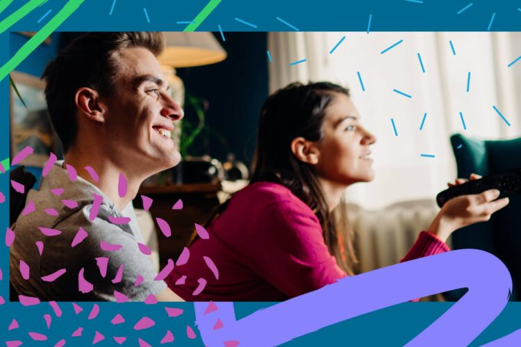 Two people sitting indoors, smiling and watching television. The woman holds a remote control. Decorative graphic elements frame the image.