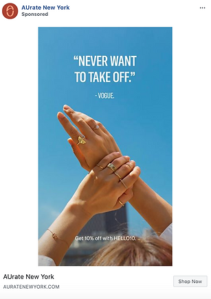 Two hands with multiple gold rings are raised against a clear blue sky. Text reads: "Never want to take off." by Vogue. Offer: Get 10% off with HELLO10.