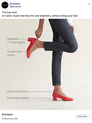 A person wearing red low-heeled shoes stands on one foot, holding up the other heel. Labels highlight cushioned insole, 2" heel height, elasticized back, and soft Italian leather.