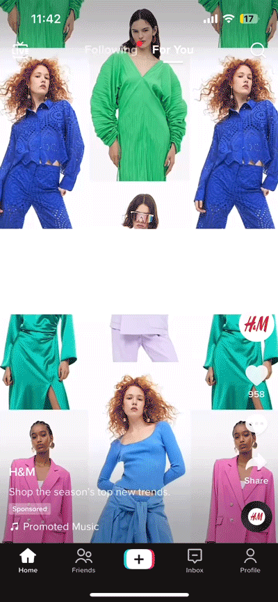 A TikTok app screen displays a sponsored H&M video featuring models in bright blue, green, and pink outfits, with engagement icons visible on the right side.