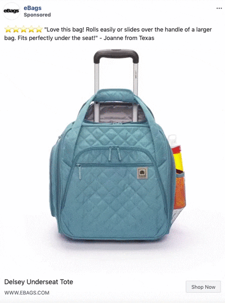 A teal quilted tote bag with multiple compartments sits on top of a rolling suitcase, with a water bottle and other items in side pockets.