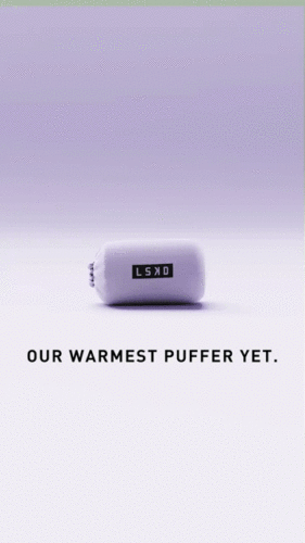 A compact, light purple puffer jacket with an LSKD label is packed into a small pouch. Black text below reads, "OUR WARMEST PUFFER YET.