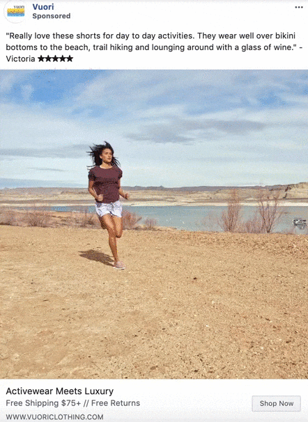 A woman runs outdoors on a dirt path with a lake and mountains in the background under a partly cloudy sky.