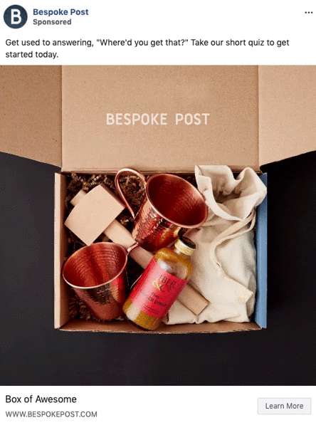 Open cardboard box containing two copper mugs, a cocktail mixer, a jigger, and a cloth pouch, with "BESPOKE POST" printed inside the lid.