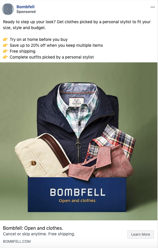 A Bombfell subscription box contains a navy jacket, plaid shirt, checked shirt, pink patterned tie, and khaki pants, displayed against a green background.
