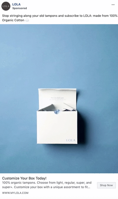 An open white box labeled "LOLA" containing tampons is displayed on a plain blue background.