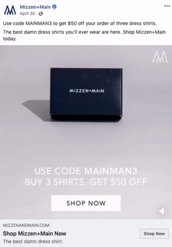 A navy Mizzen+Main box on a beige surface with text promoting $50 off when buying three dress shirts using code MAINMAN3.