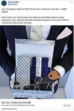A person in a suit holds an open SprezzaBox containing a necktie, socks, a watch, sunglasses, and other accessories. Text above offers a discount code for the first box.