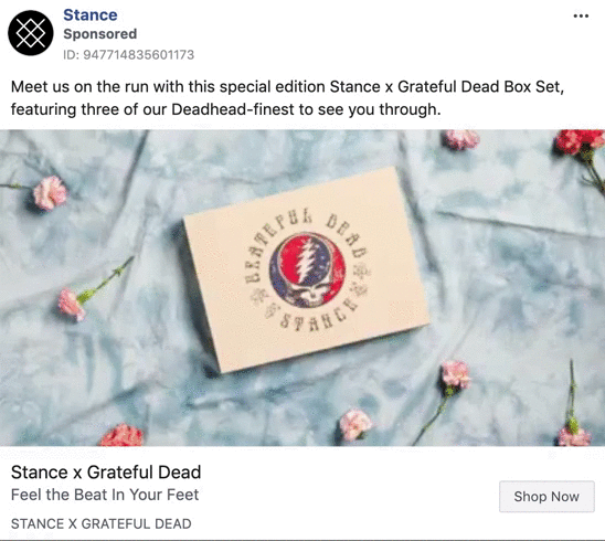 A rectangular Stance x Grateful Dead box set sits on blue fabric with scattered pink flowers. The box features the band's logo and text.