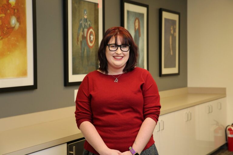 A woman in a red shirt.