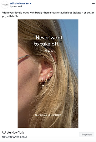Close-up of a woman’s ear wearing multiple gold earrings, with text overlay quoting Vogue and offering 10% off at AUrate New York.