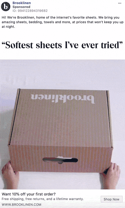 Hands open a cardboard Brooklinen box on a white surface, revealing neatly packaged bedding products inside.