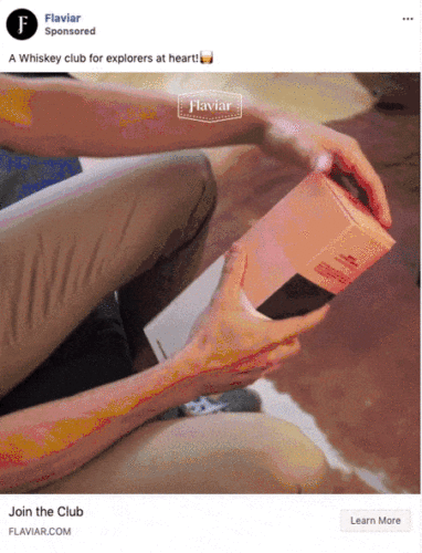 A person opens a pink and black whiskey box while sitting on the floor. The text reads, "A Whiskey club for explorers at heart!" and "Join the Club.