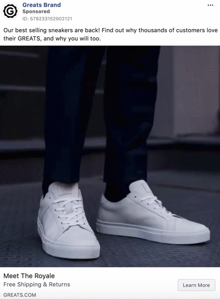 A person wearing white low-top sneakers and dark pants stands on a textured floor. The ad promotes "The Royale" sneakers by Greats Brand.