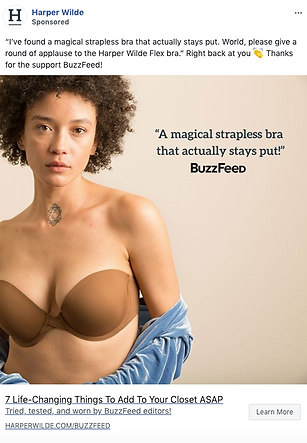 A woman wearing a brown strapless bra and blue shirt poses against a beige background next to the text: "A magical strapless bra that actually stays put!" BuzzFeed.