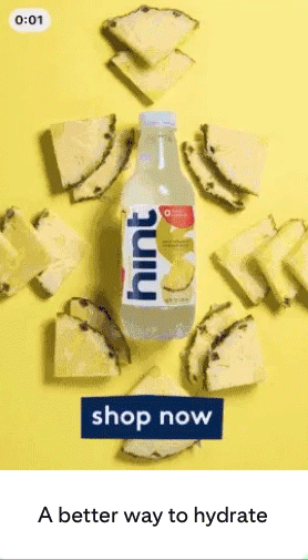 A bottle of Hint pineapple-flavored water is surrounded by pineapple slices on a yellow background with the text "shop now" and "A better way to hydrate.