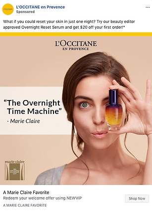 A woman holds a small bottle of L’Occitane Overnight Reset Serum near her face, with a quote about the product and an offer for $20 off a first order displayed on the image.