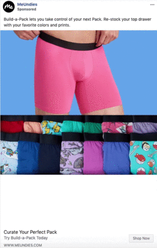 A person wears bright pink fitted shorts above a row of colorful underwear with various patterns and prints displayed below.