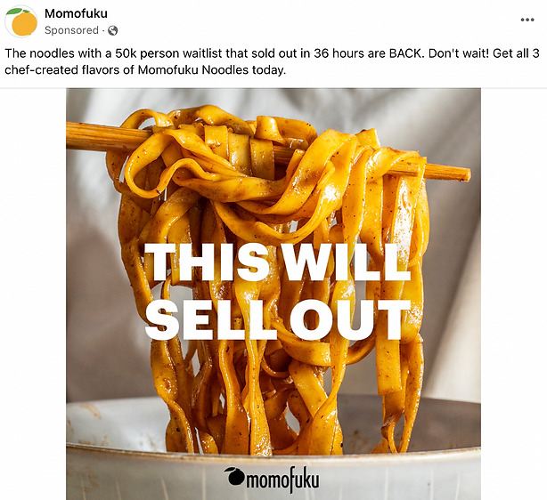 Wide noodles coated in sauce are held up by chopsticks over a bowl, with the text "THIS WILL SELL OUT" superimposed on the image. The Momofuku logo appears at the bottom.