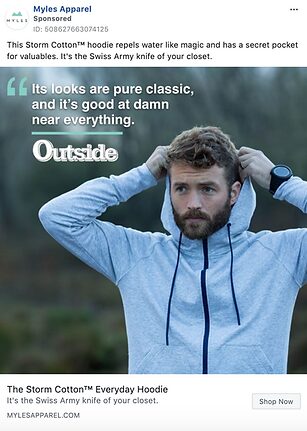 A man wears a light gray zip-up hoodie with dark trim, outdoors, holding the hood with both hands. Text on the image promotes the hoodie’s classic look and versatility.