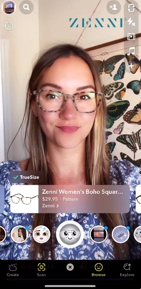 A woman is using a virtual try-on filter for Zenni Women’s Boho Square glasses on a mobile app, with butterfly wall art in the background. App interface elements are visible on screen.