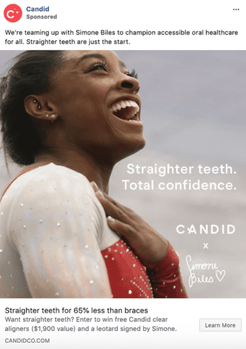 A woman in a red and white athletic outfit smiles broadly with hand on chest; text reads "Straighter teeth. Total confidence. Candid x Simone Biles.