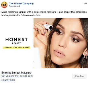 A woman applies mascara to her eyelashes using a dual-ended mascara and lash primer; the text promotes Honest Beauty Extreme Length Mascara.
