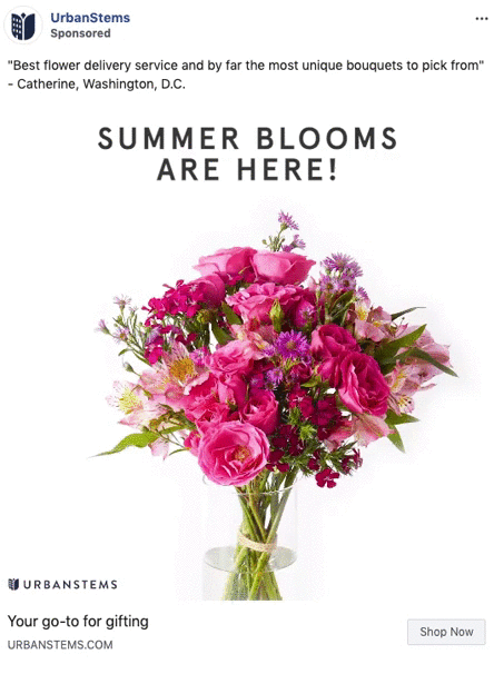 A bouquet of pink and purple flowers in a glass vase is displayed under the text "SUMMER BLOOMS ARE HERE!" in an advertisement for UrbanStems.