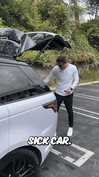 A man wearing sunglasses and a white long-sleeve shirt stands by the open trunk of a black SUV in a parking lot. The text "SICK CAR." is overlaid at the bottom.