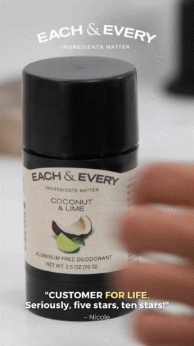 A hand reaching for a black Each & Every Coconut & Lime aluminum free deodorant stick with a customer review and brand tagline visible.