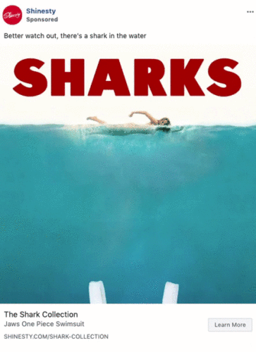 A person swims near the water surface with large red text "SHARKS" above; image promotes swimsuits from The Shark Collection by Shinesty.