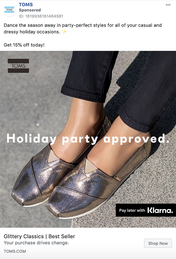 Close-up of a person wearing shiny, metallic slip-on shoes with black pants; text promotes holiday party styles and a 15% discount from TOMS, with Klarna payment option.
