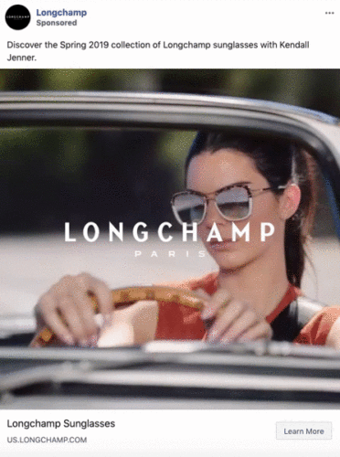 A woman wearing reflective sunglasses drives a car; the Longchamp Paris logo is overlaid on the image.