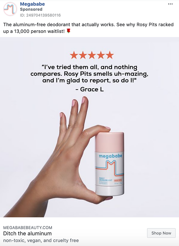 A hand holds a Megababe Rosy Pits deodorant against a neutral background, with a five-star review and product description displayed above.