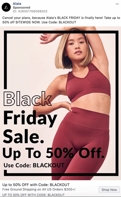 Woman in red athletic wear poses in front of a sign advertising Alala's Black Friday sale with up to 50% off sitewide, using the code BLACKOUT.